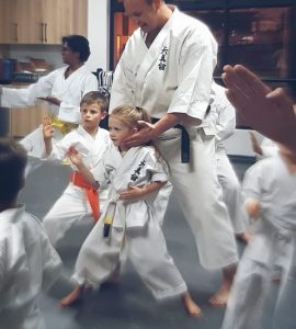 Shugoryuu Karate Centurion Sensei Gerhard helping a child